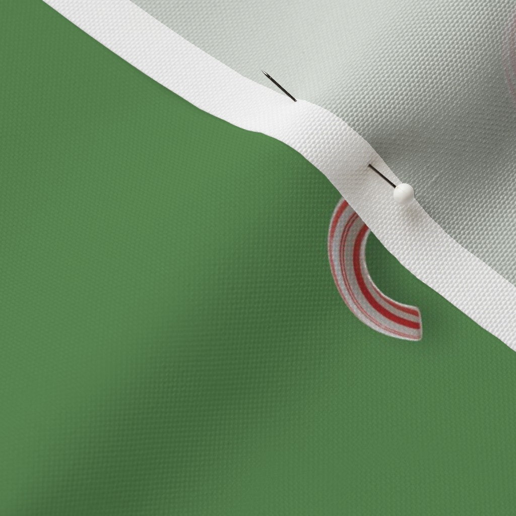 Candy Canes on Solid Green Fabric