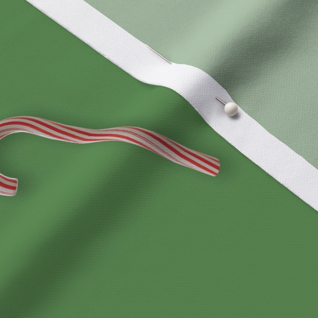 Candy Canes on Solid Green Fabric