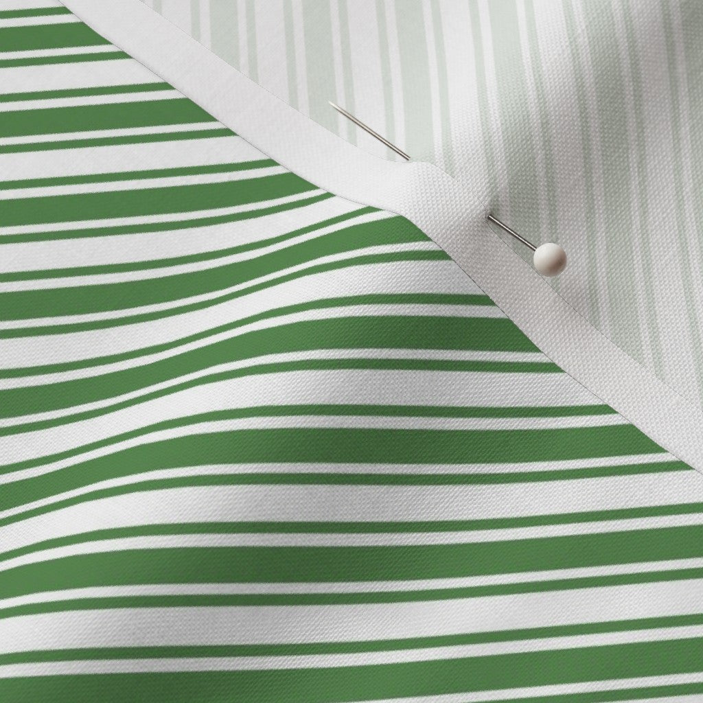 Tela verde y blanca con rayas de bastones de caramelo