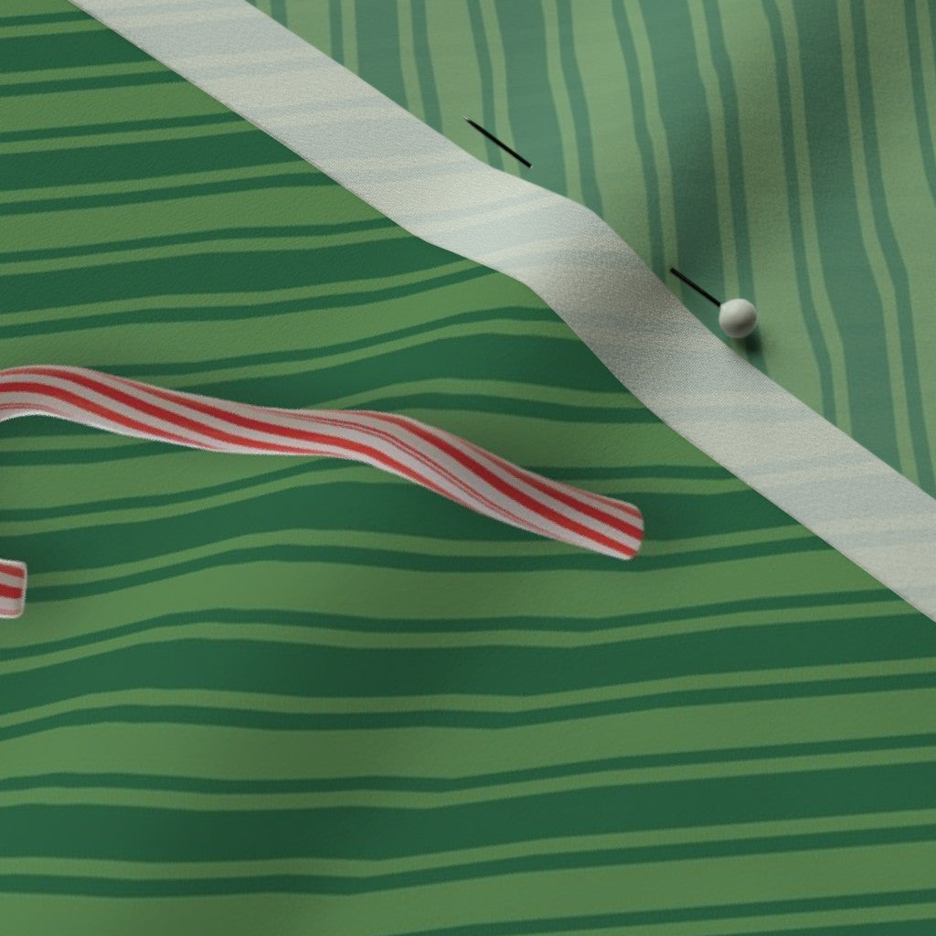 Bastones de caramelo en tela de rayas verdes