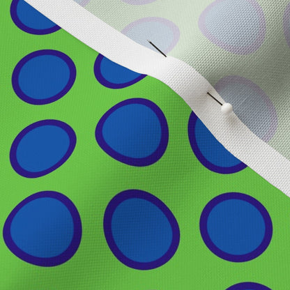 Dark Blue Dots on Green Fabric
