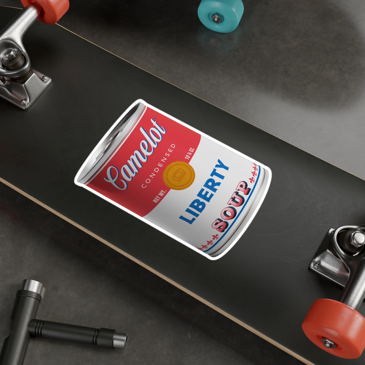 Camelot brand condensed Liberty Soup - 6 x 8 inch vinyl sticker shown on a skateboard, by Studio Ten Design