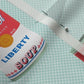 Liberty Soup Cans Poly Crepe de Chine Printed Fabric by Studio Ten Design